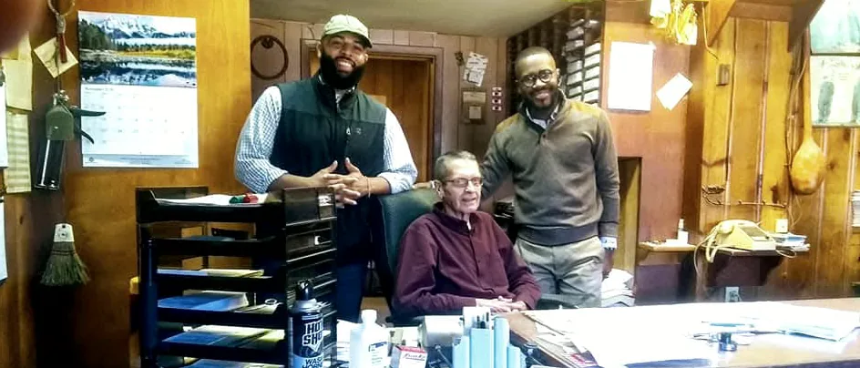 B. Simmons team meeting with facility staff in the terminal office