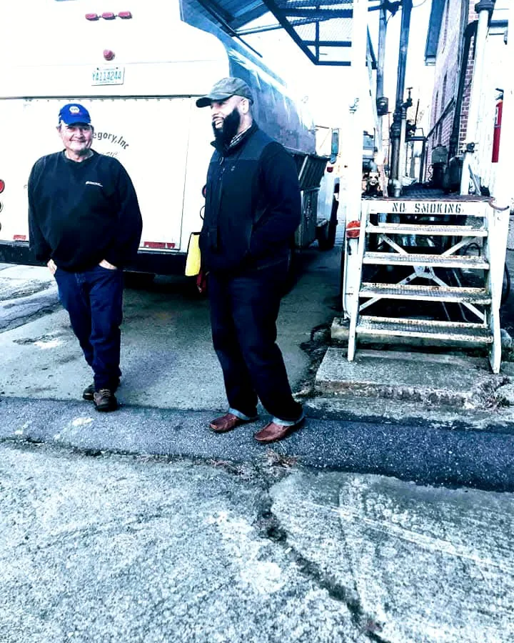 B. Simmons representative with a terminal operator beside a tanker at the loading rack